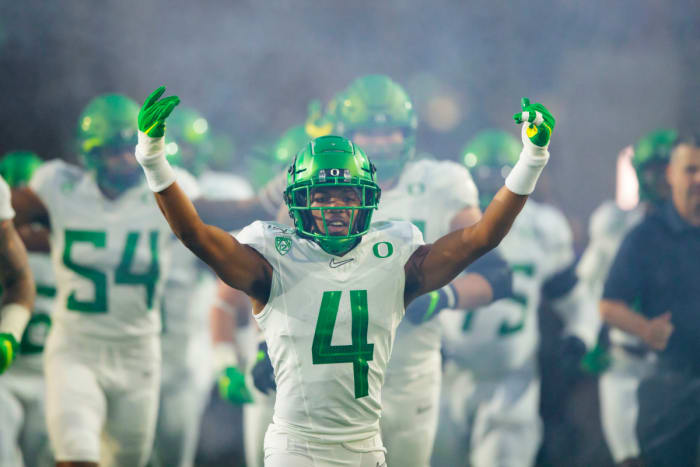 Thomas Graham (4) leads Oregon out of the tunnel against Arizona State in Tempe, Arizona, on November 23, 2019.